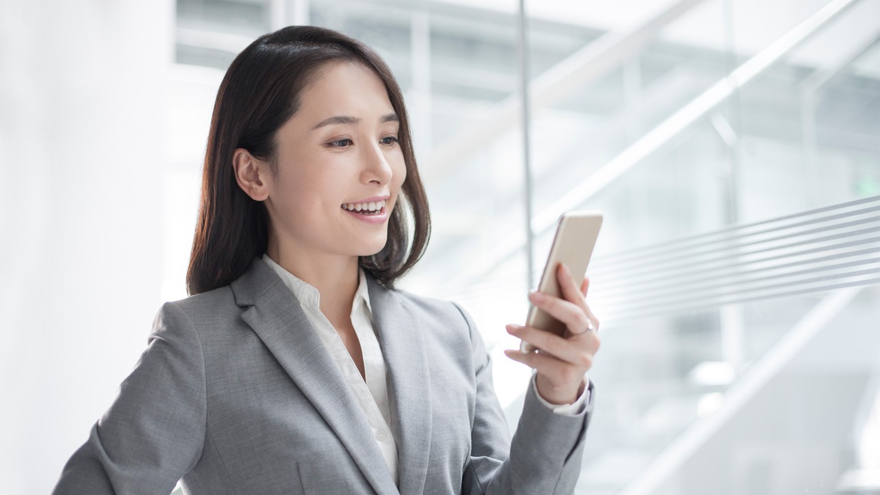 Lady leaning by the window; the image used for setting savings goals