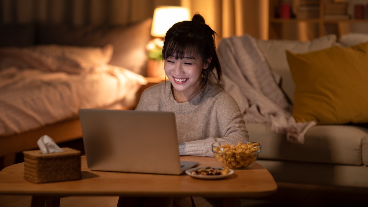 Girl watching computer in bed; the image used for understanding interest